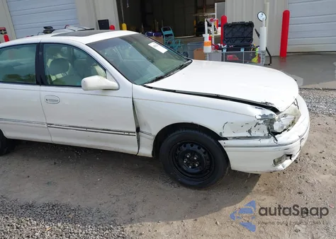 1999 Toyota Avalon Xls z USA, uszkodzony, nr VIN 4T1BF18B0XU301241
